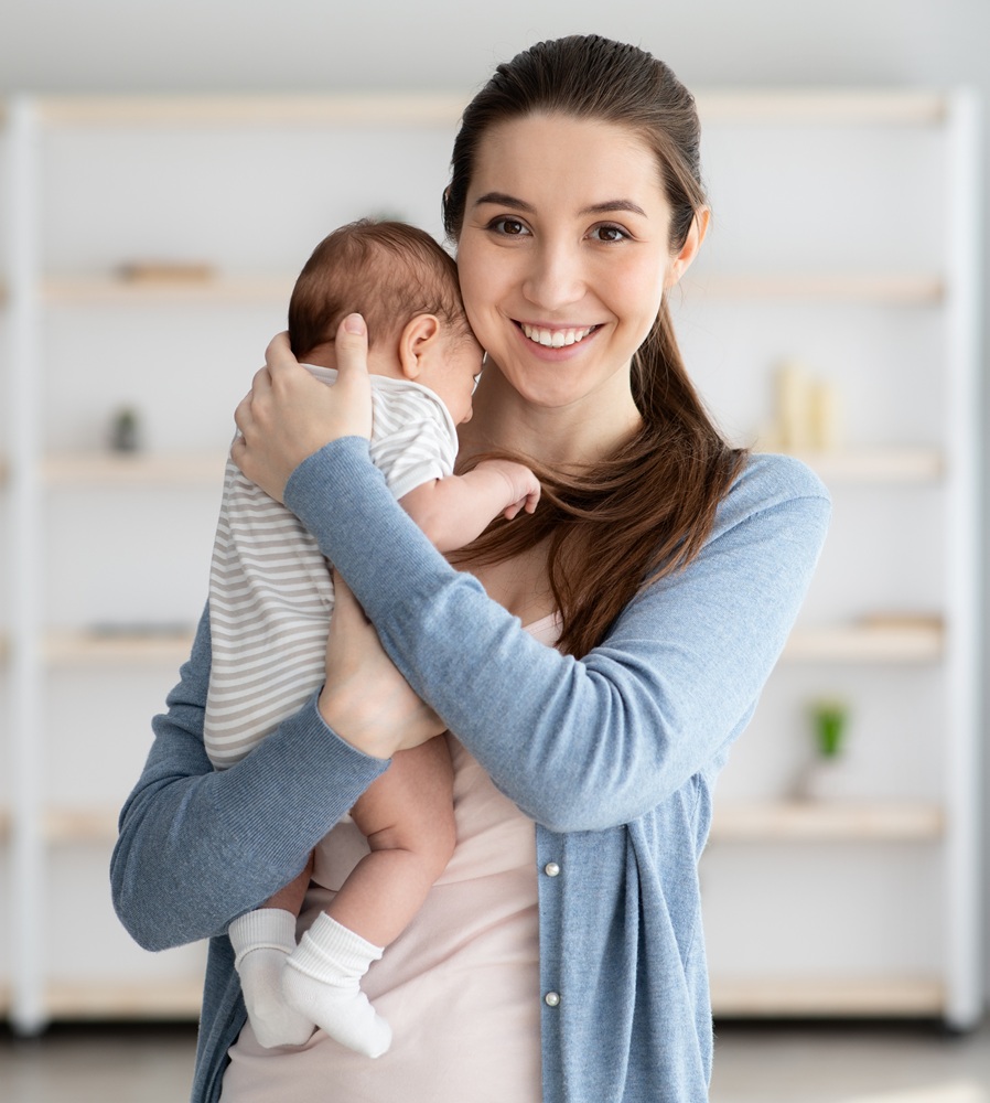 sleep consultant holding sleeping baby