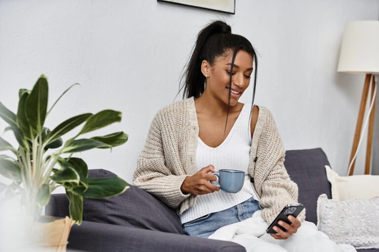 woman smiling holding smartphone posting to social media