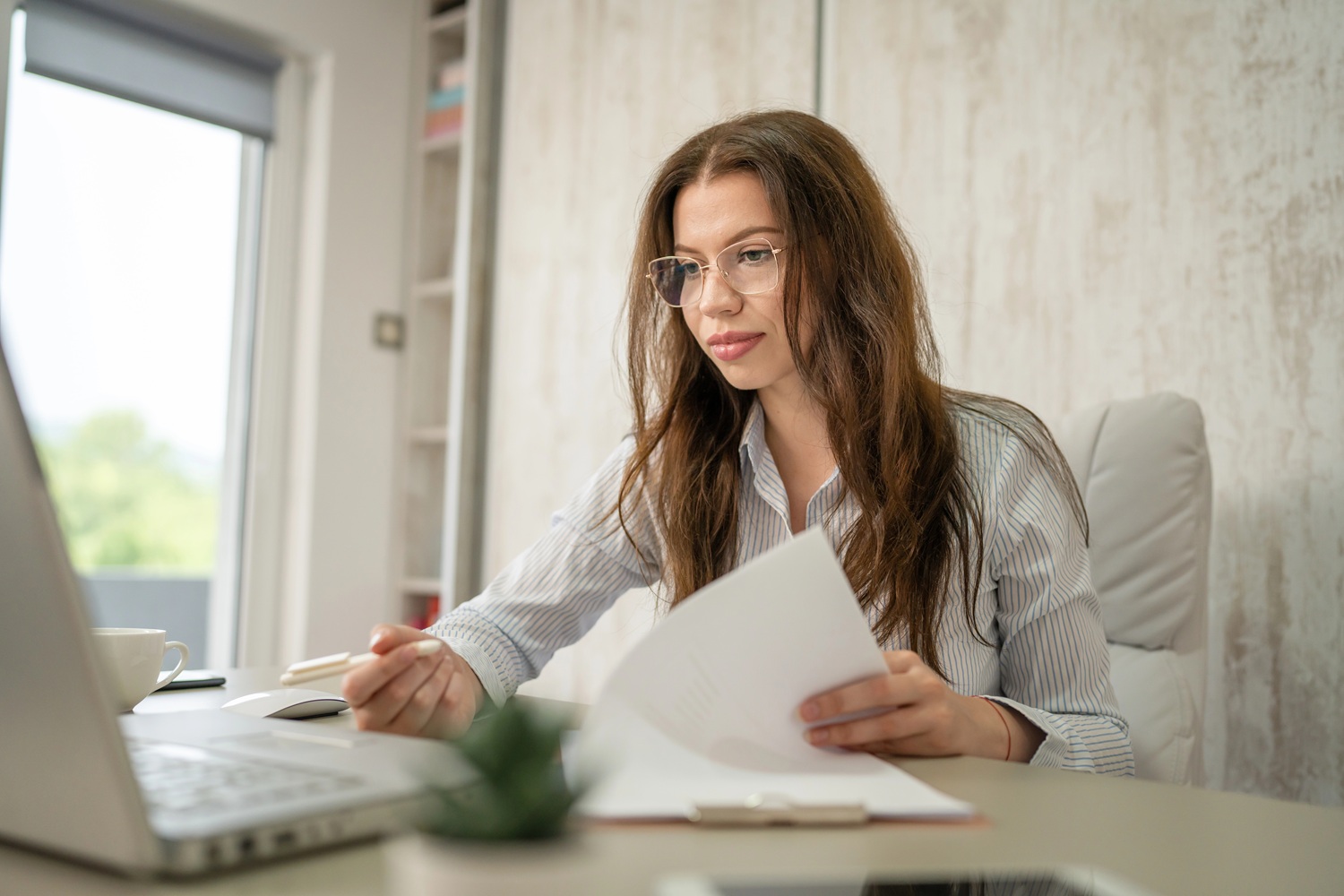 woman researching on a laptop
