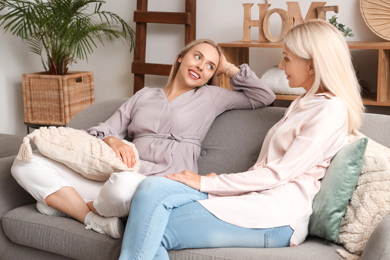 women talking on a couch